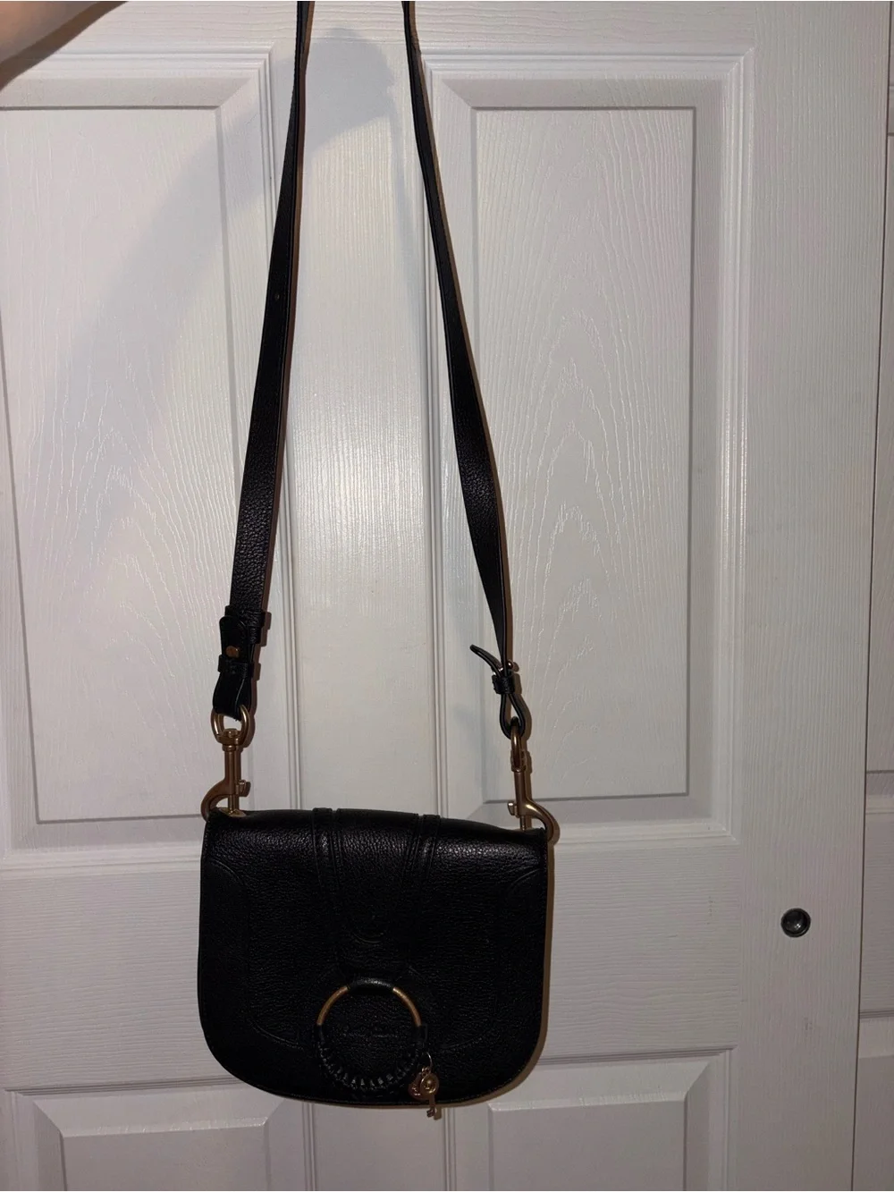 See By Chloe Black mini Hana Leather Saddle Crossbody with Gold Ring Detail